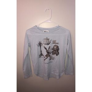 A light blue beauty and the beast shirt